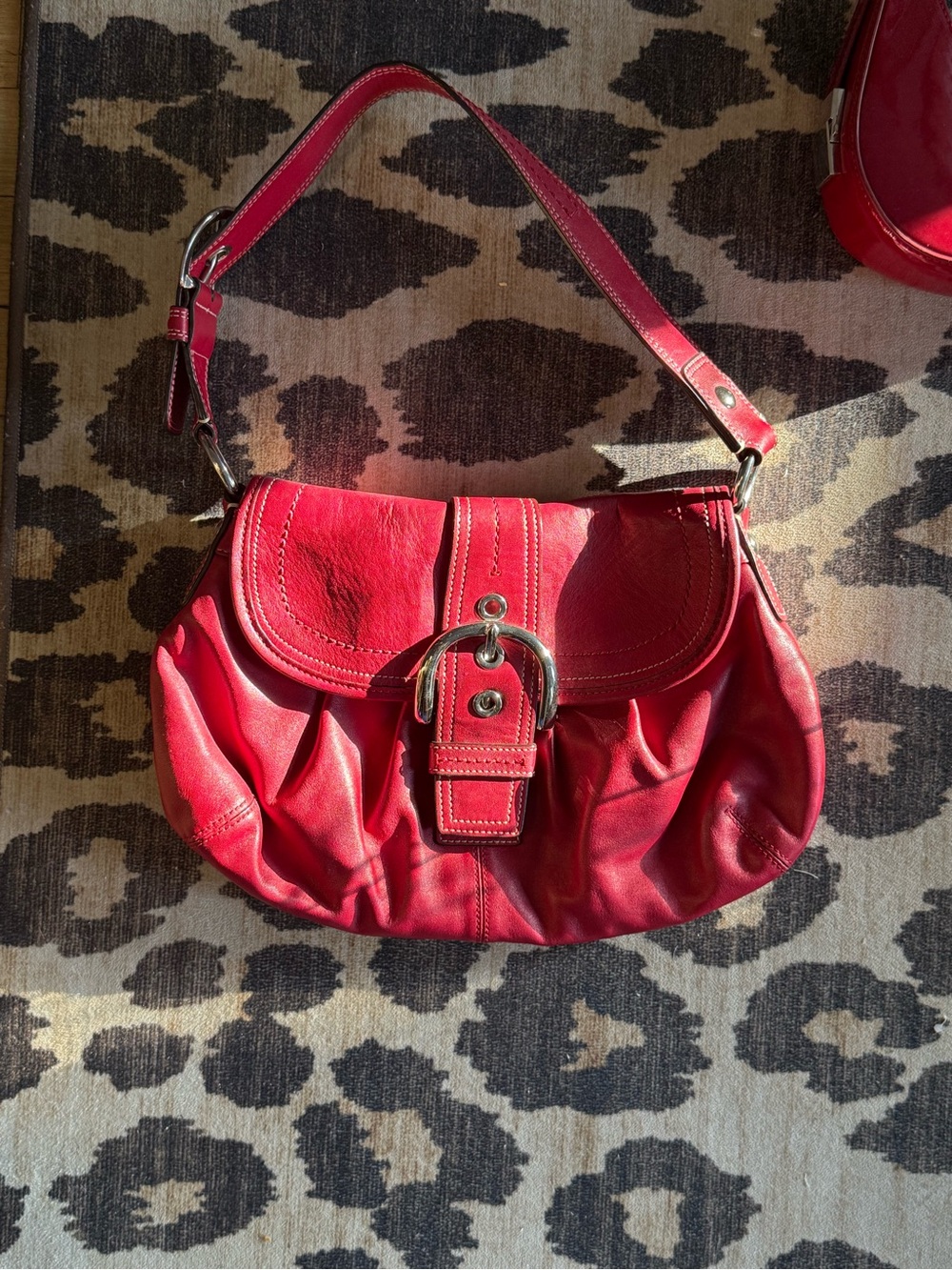 Coach: Red Leather Shoulder Bag with Buckle Accent